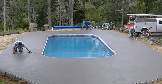 Preparing poured concrete deck for a swimming pool for stamping